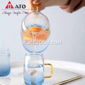 Alta caraffa in acqua blu graduata con borosilicato con tazza